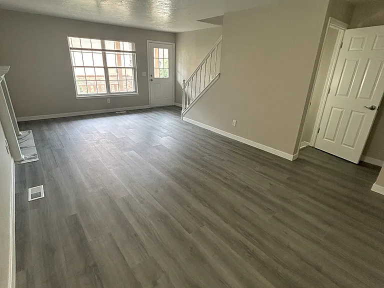Main Floor living room 12' x 21' with real wood burning fireplace