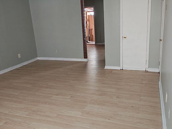 Living room with closet and bathroom