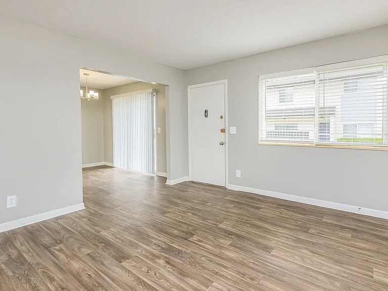Spacious living room with hardwood-style flooring