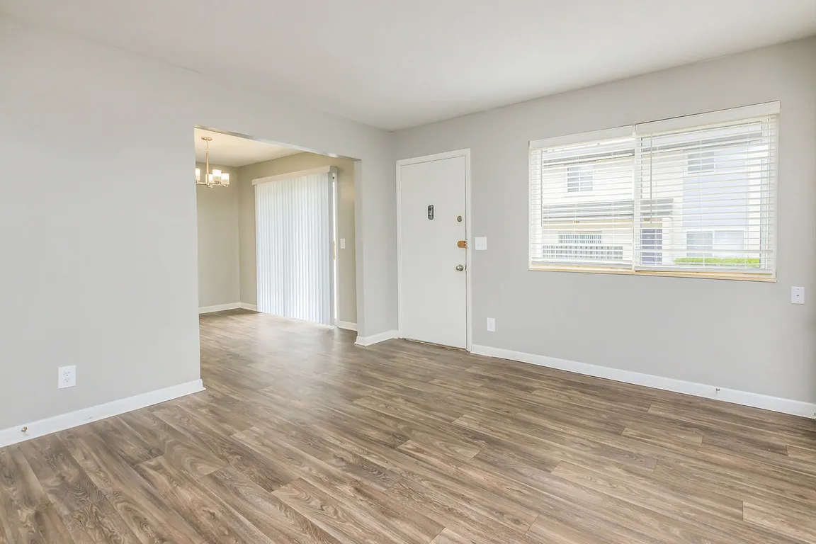 Spacious living room with hardwood-style flooring