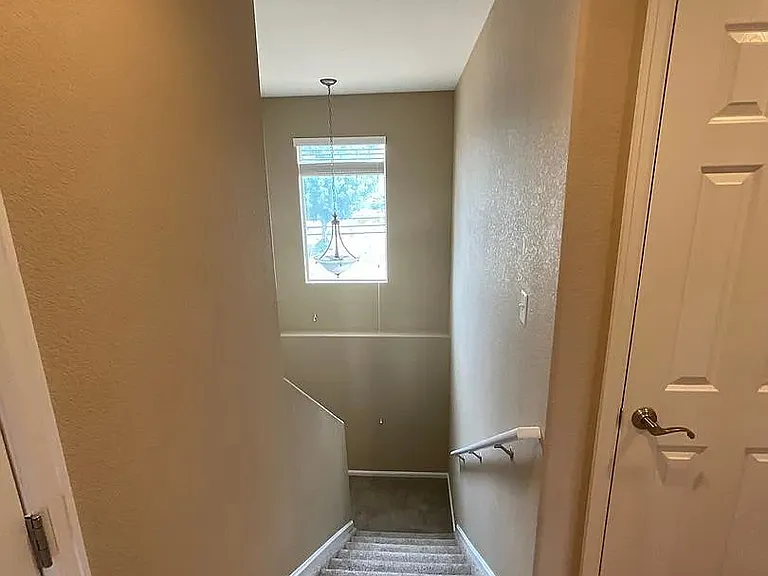 Stairs to basement for Bedroom 4 and home theater