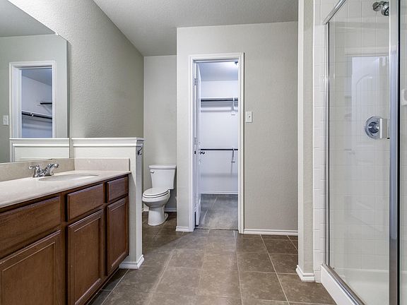 Primary bathroom with large walk-in closet.