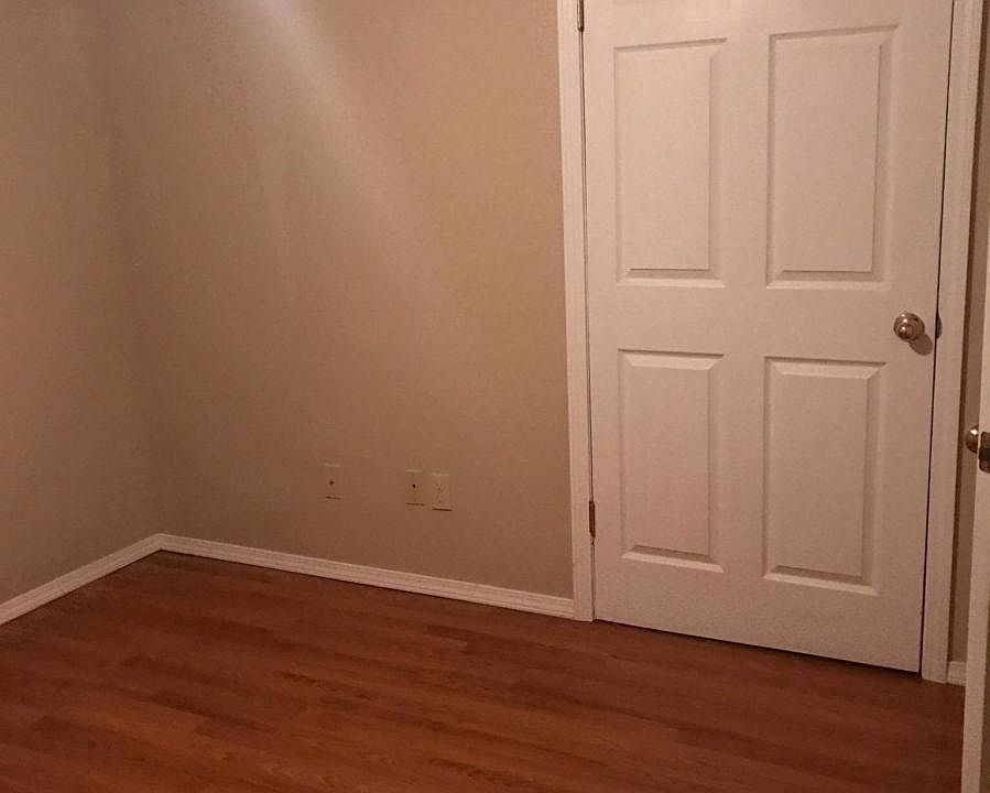 bedroom with hard wood floors
