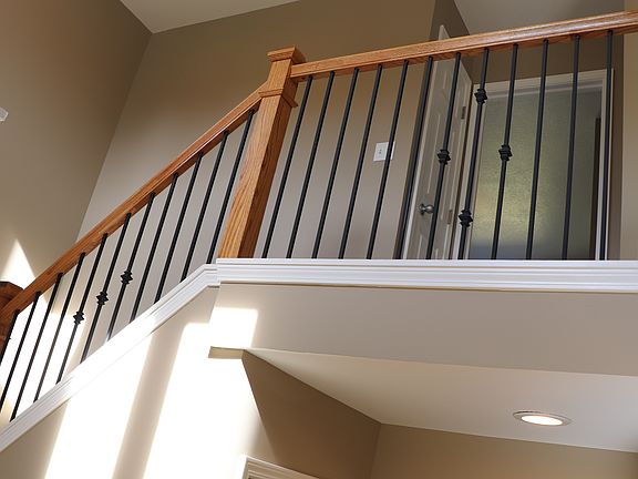 staircase with 2 story foyer