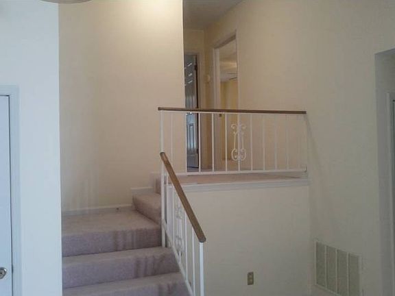 Stairs to bedrooms, baths