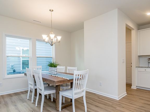 A dining area in the great rooms offers the perfect place for family dinners.