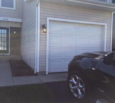 Front of townhouse with one car garage