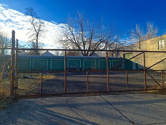 8 Enclosed Garages, and Fenced Parking lot