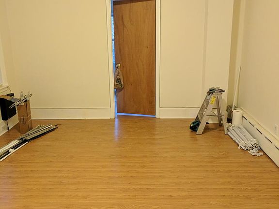 living room with bonus room door