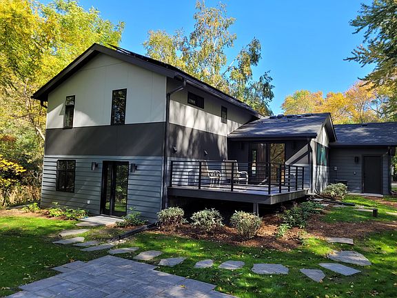 Wooded back yard with private deck and patio, walkout lower level.