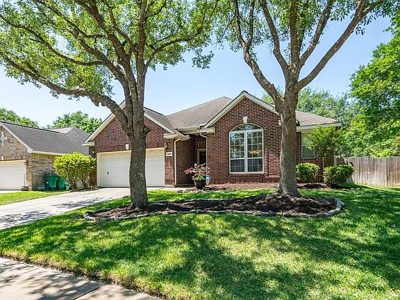 A lush lawn with mature trees offers great curb appeal to this home!