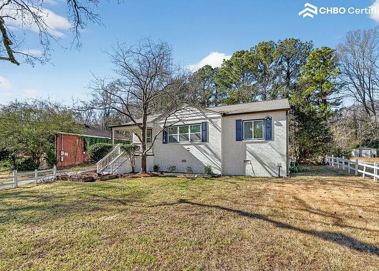 Welcoming front entrance with quiet neighborhood charm.