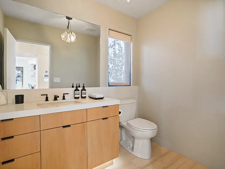 Refresh in a sleek en suite stocked with premium essentials.