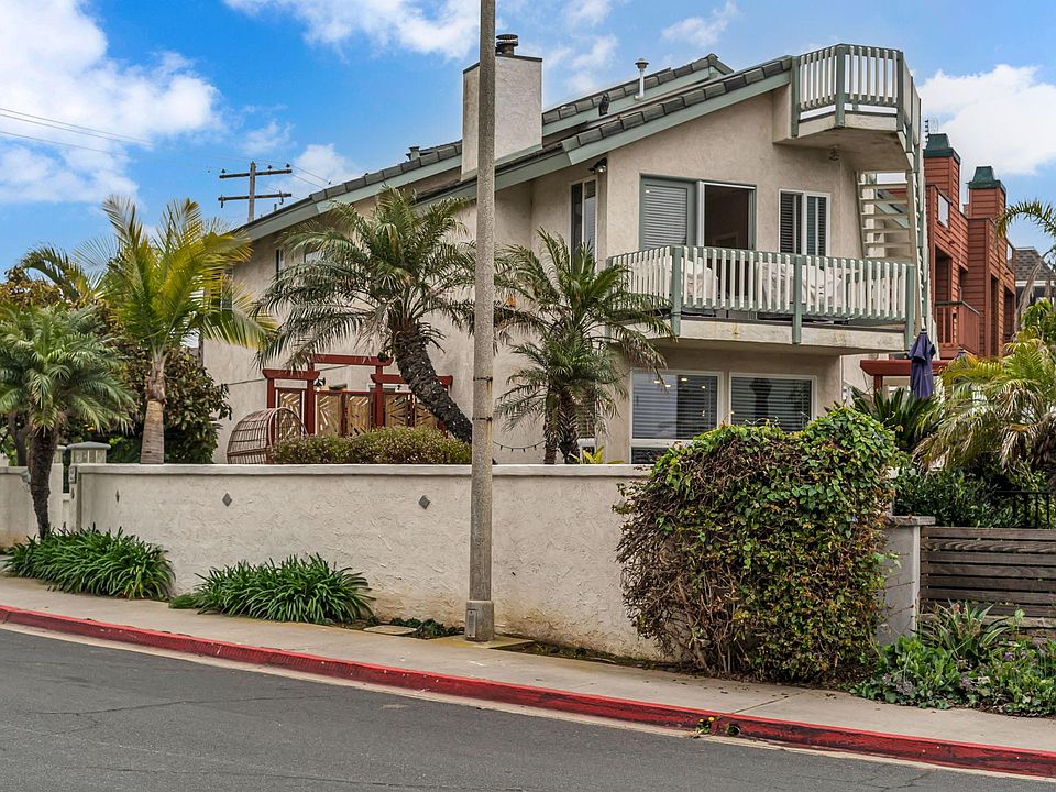 STREET VIEW SHOWING ROOF DECK, MASTER BEDROOM BALCONY AND CUSTOM WALL SURROUND