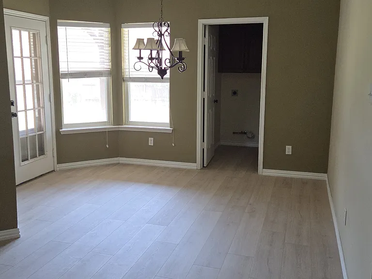 Breakfast nook leading to patio laundry and garage