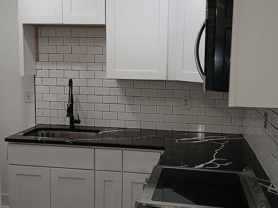 Fully remodeled kitchen with all new stainless steel appliance, luxury vinyl flooring and ceiling fan