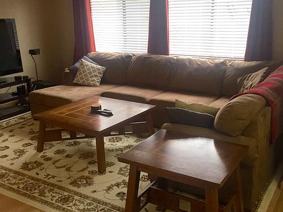Top floor living room windows allow lots of natural light