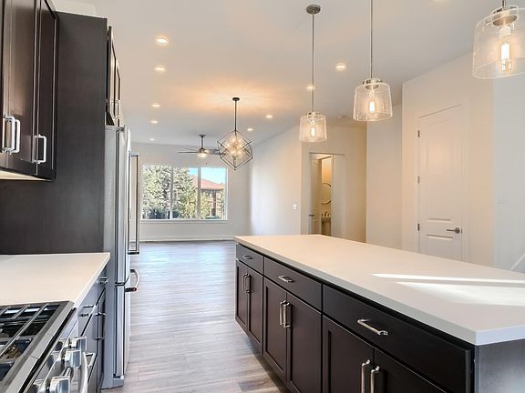 2nd floor view of dining and living rooms from kitchen