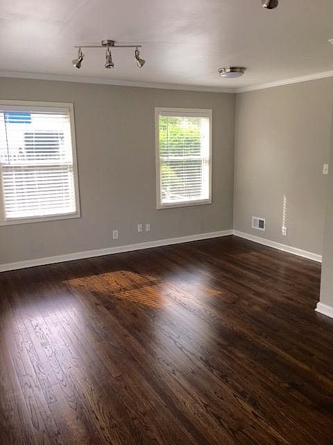 Spacious and open layout with original hardwood floors. 