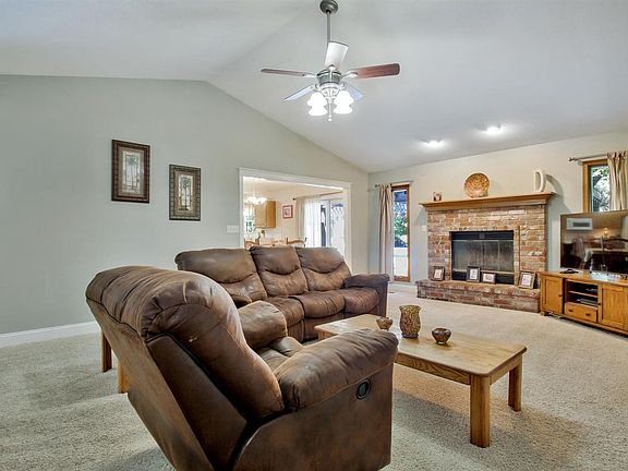 Large great room with brick fireplace.