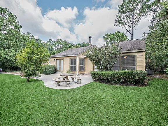 Back Courtyard view of the home with the 2nd patio seating area. MASTER Bedroom #2 is on the right with
large windows viewing the garden.