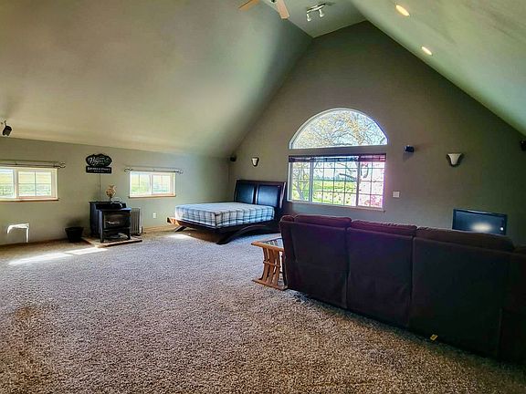View of trees and view out of window. Space for additional furniture.