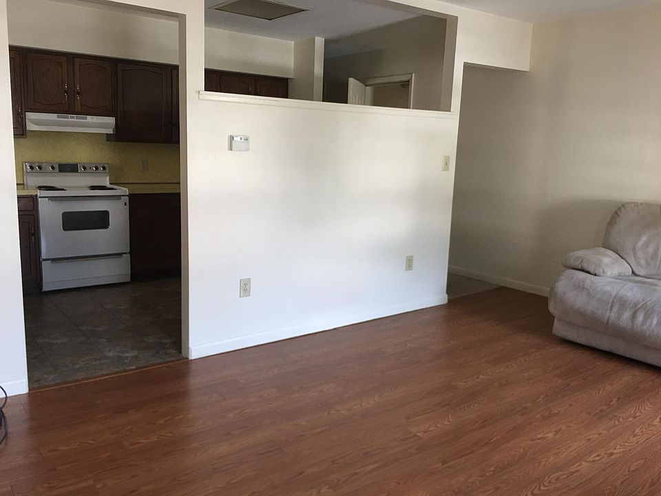 Large living room with wood laminate floors