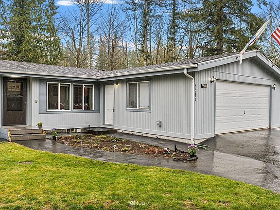 front of property, two car attached garage with man door