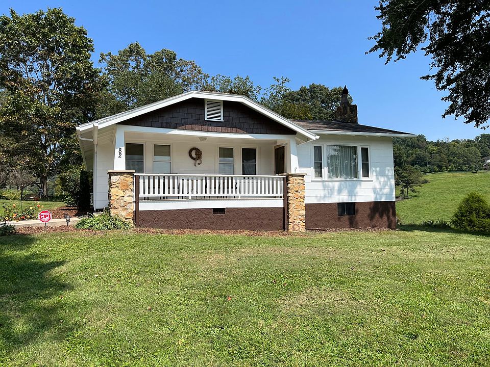 Front view of arts and craft home with view of Mt Pisgah from porch.