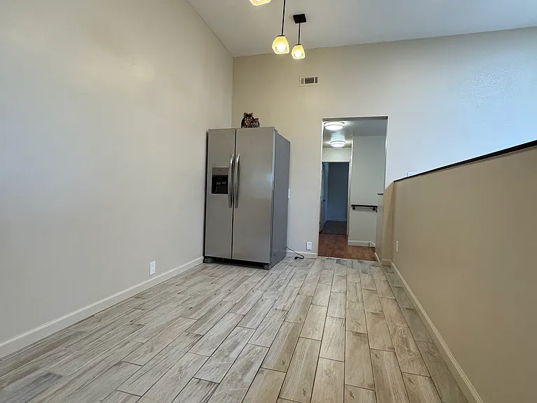 upstairs large hallway separating two upstairs bathroom. This space can be turned in to a mini kitchenette