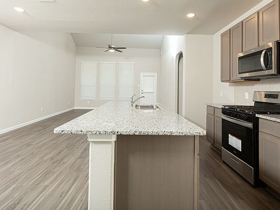 Kitchen and Dining Area to Family Room