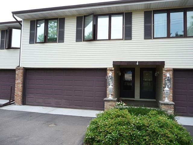 Double car attached garage with new garage door opener.