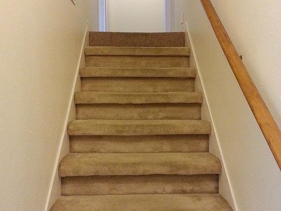 Stairs to 3 bedrooms + bath