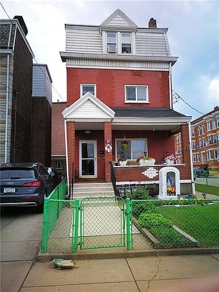 Front Exterior with separate entrance to 2nd and 3rd floors.