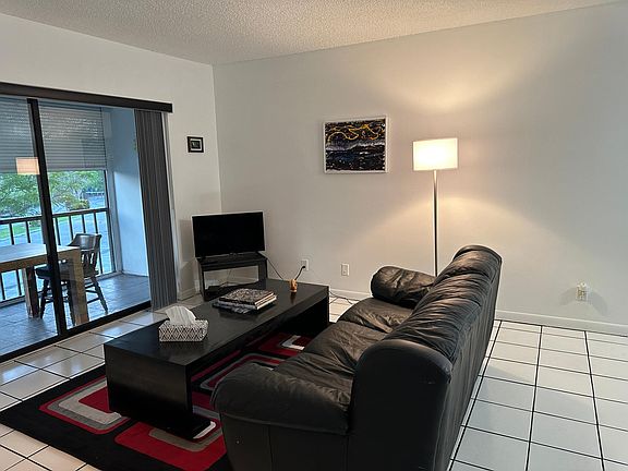 Living room: right wall, new rug