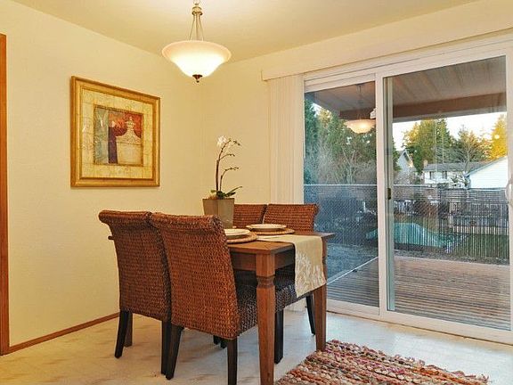 Bright dining area with access to 1 car garage and covered patio