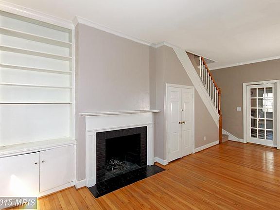 Built-in bookcases and wood-burning fireplace