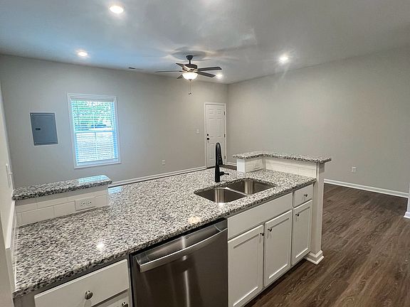 A modern kitchen with brand-new stainless appliances, ready for everything from quick meals to weekend gatherings.