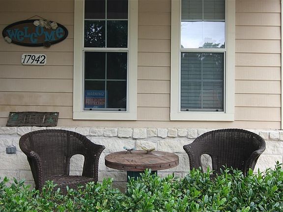 The covered front porch is prefect for this neighborly neighborhood.  Wonderful cu-de-sac location perfect for block parties or kids playing.