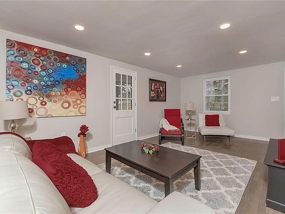 The Living Room has a Convenient Side Door Entry to the Sun Room.