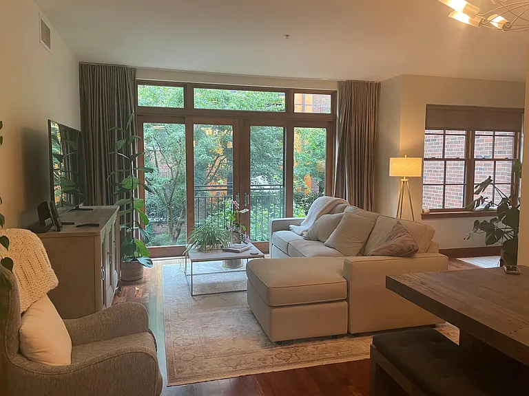 Large window and slider doors makes for a warm, bright home