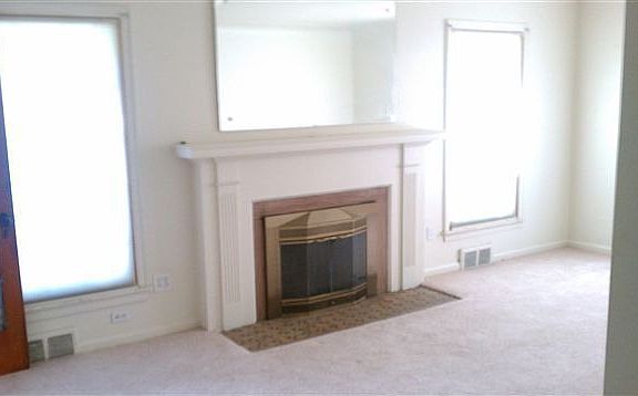 living room with natural fireplace