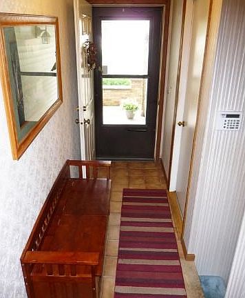 Large foyer with room for a bench.