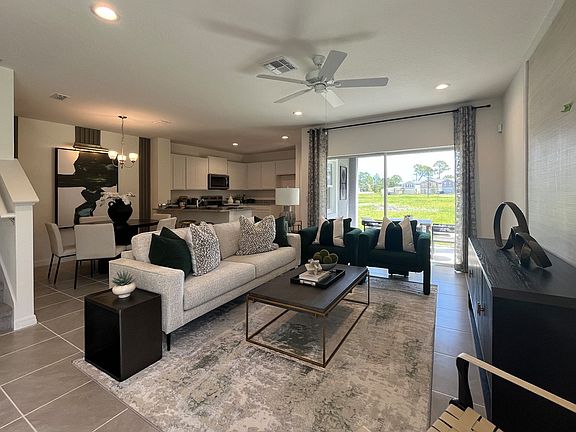 Ashley townhome exterior with covered porch in Pine Meadows, new construction in Eustis FL