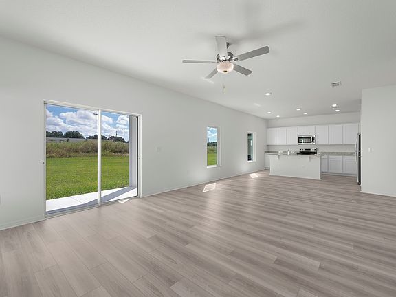Family room with a sliding door that leads to the back yard