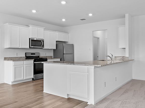 Chef-ready kitchen with abundant counterspace and storage.