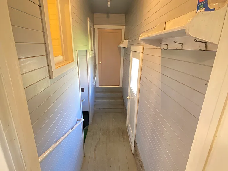 Back door entry area - goes to the basement with washer/dryer and storage room, and the backyard.