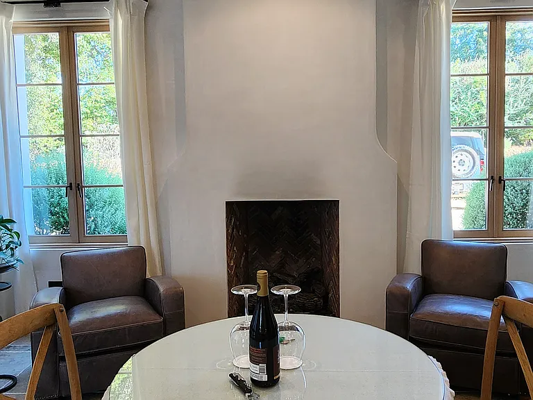 cypress suite downstairs with open face masonry gas fireplace
