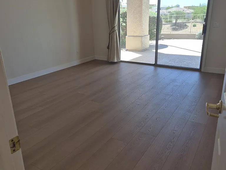 Spacious master bedroom with sliding door to backyard