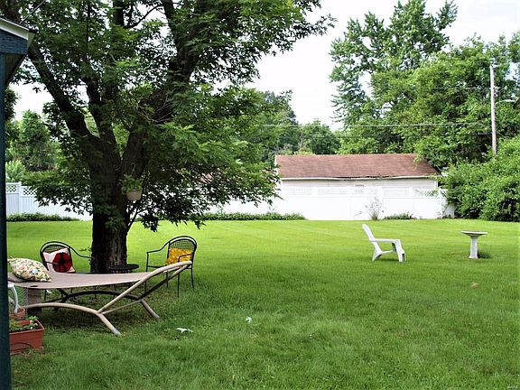 Peaceful Yard On 1/2 acre Lot For All Your Gatherings & Relaxation!
